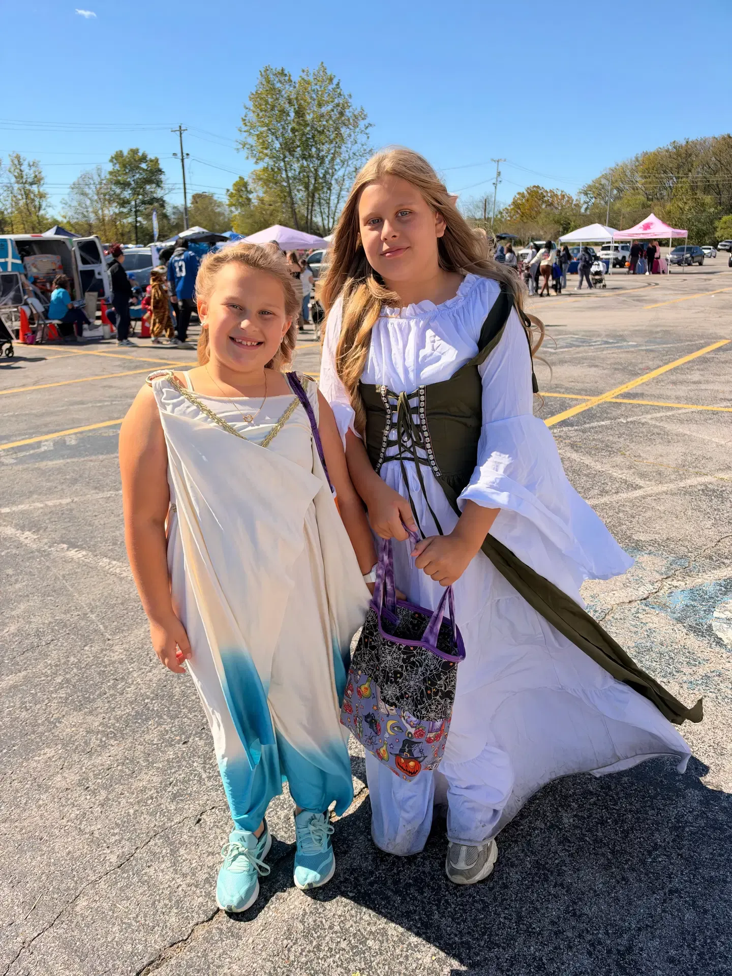 Two young festival guests in storybook-inspired costumes.