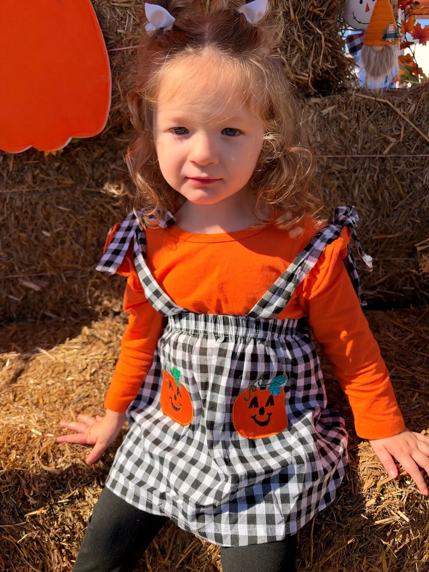 A Fall Safety Festival volunteer smiles beside the outdoor grill.