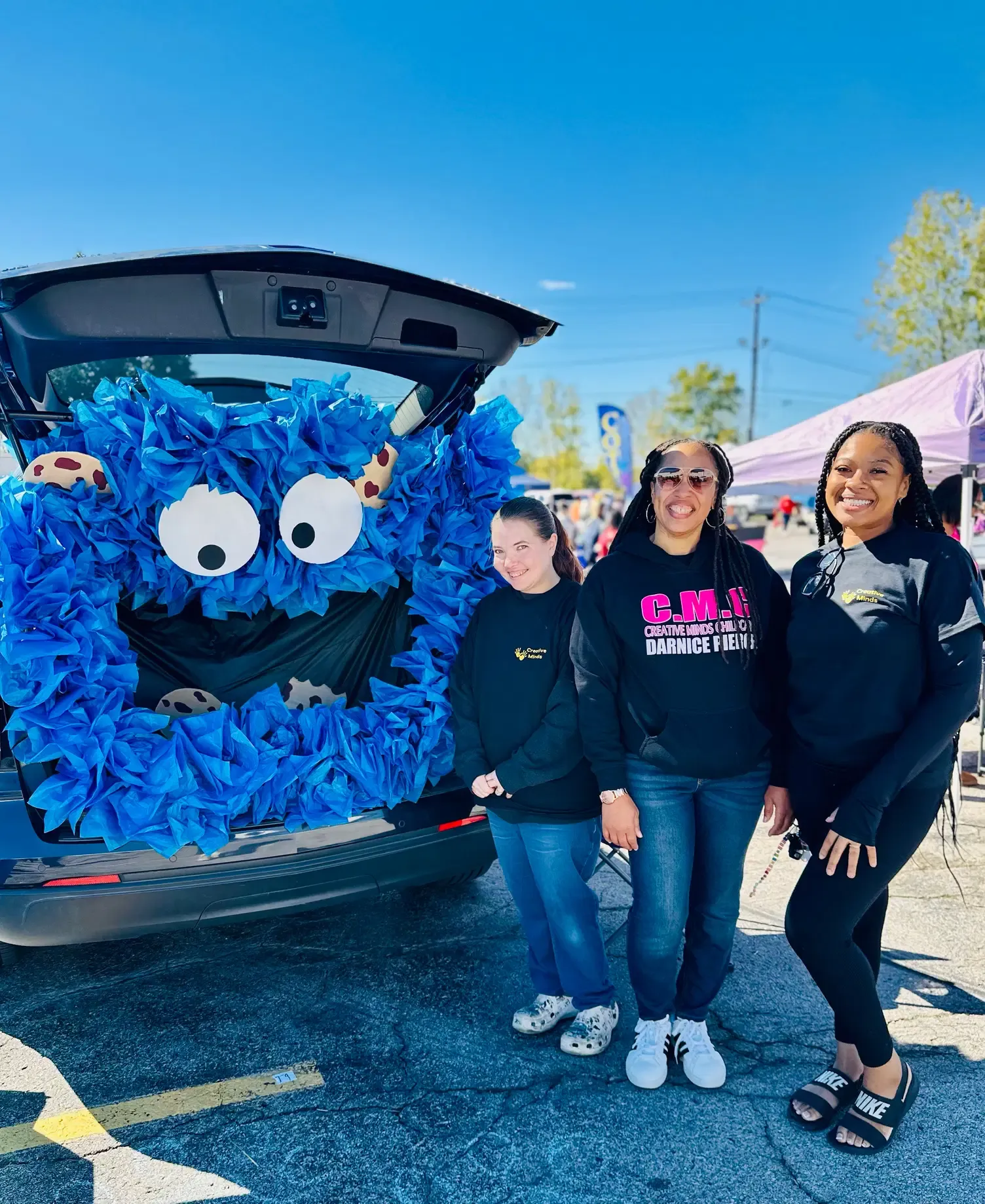 Guests visit the Habitat for Humanity trunk-or-treat display.