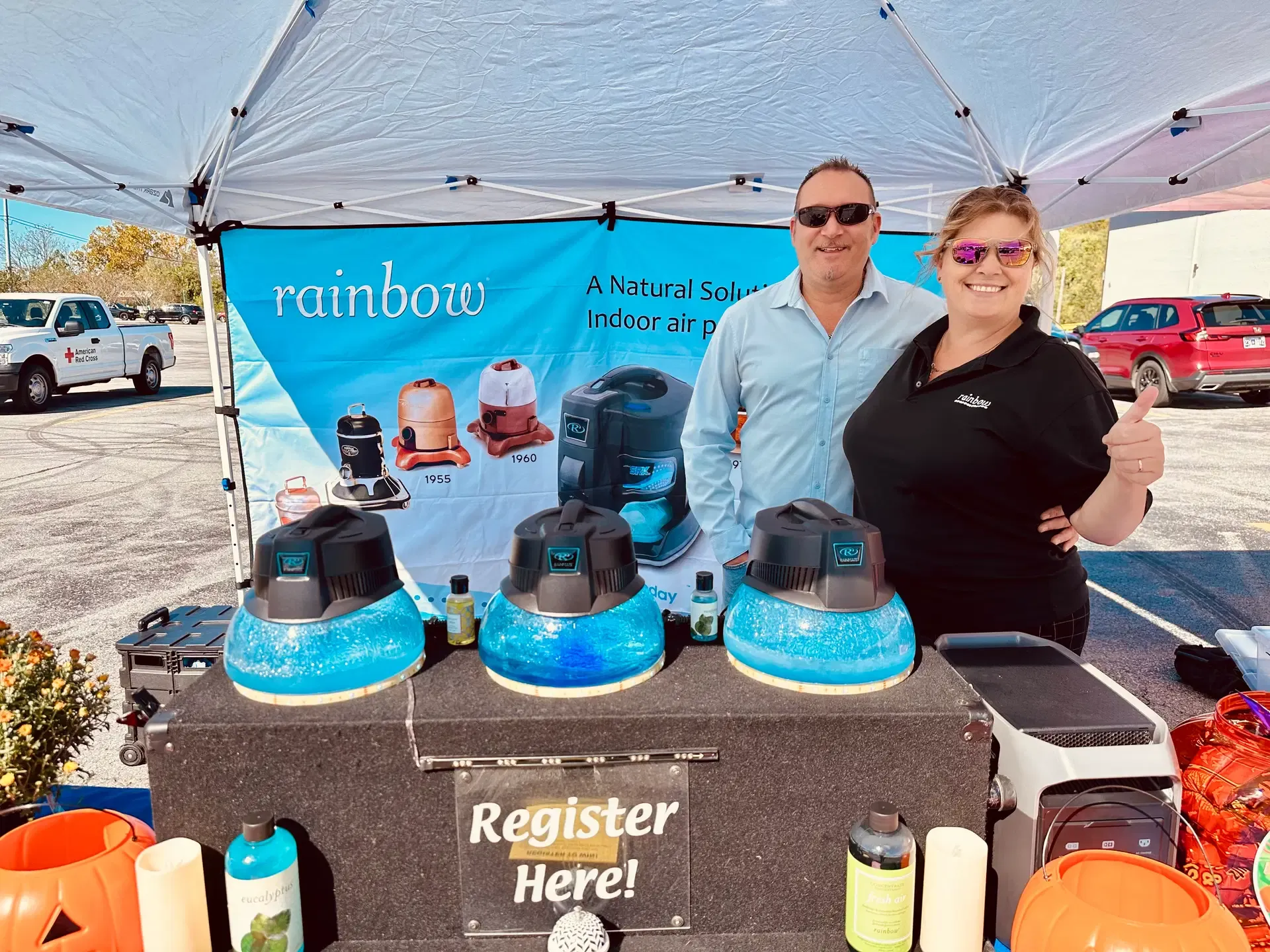 Rainbow representatives welcome visitors at their festival booth.