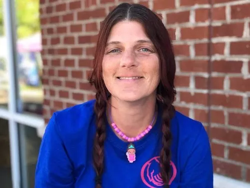 Tiffany Bowser smiling in a blue shirt